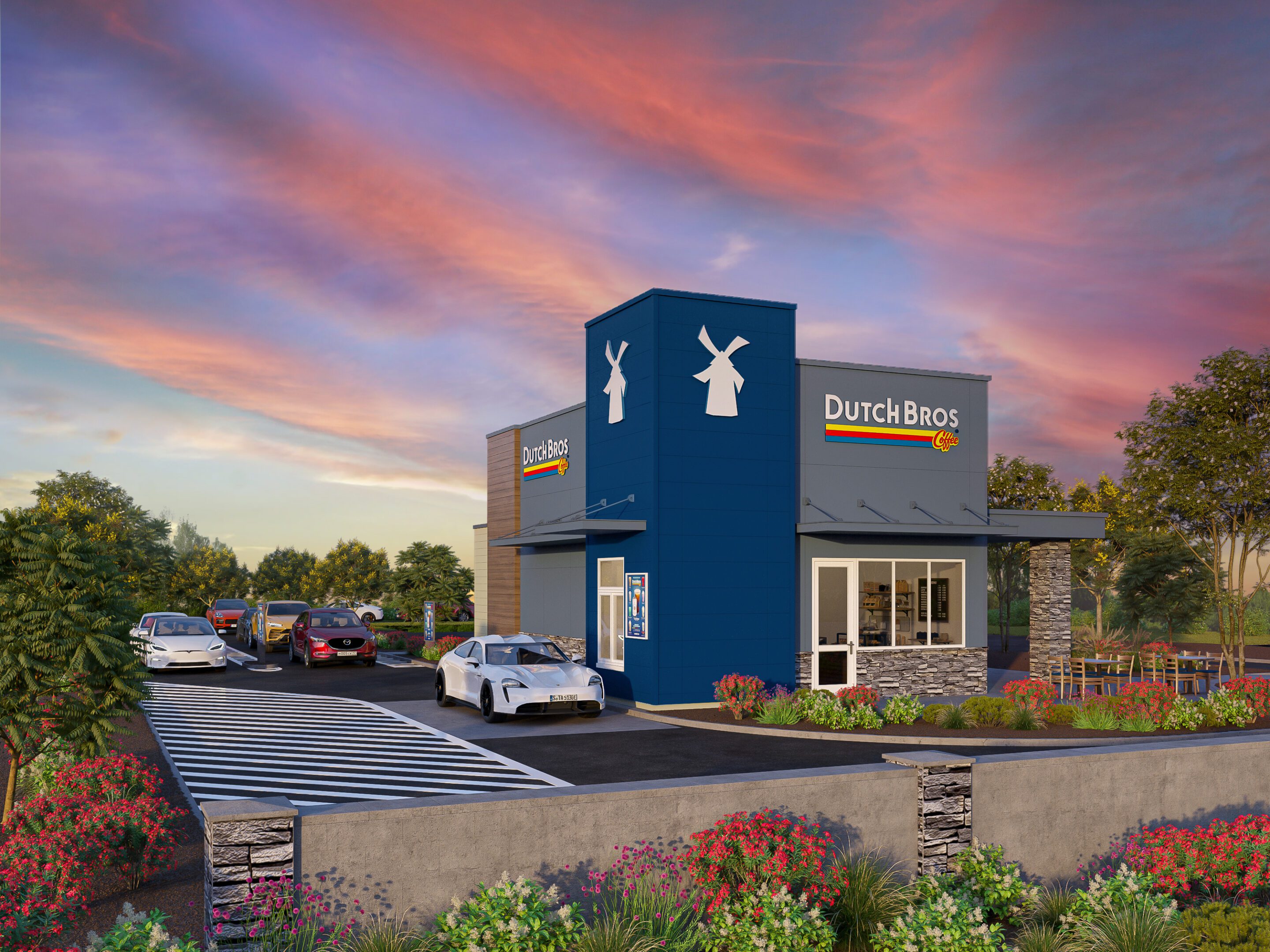 Dutch Bros drive-thru under colorful sunset sky