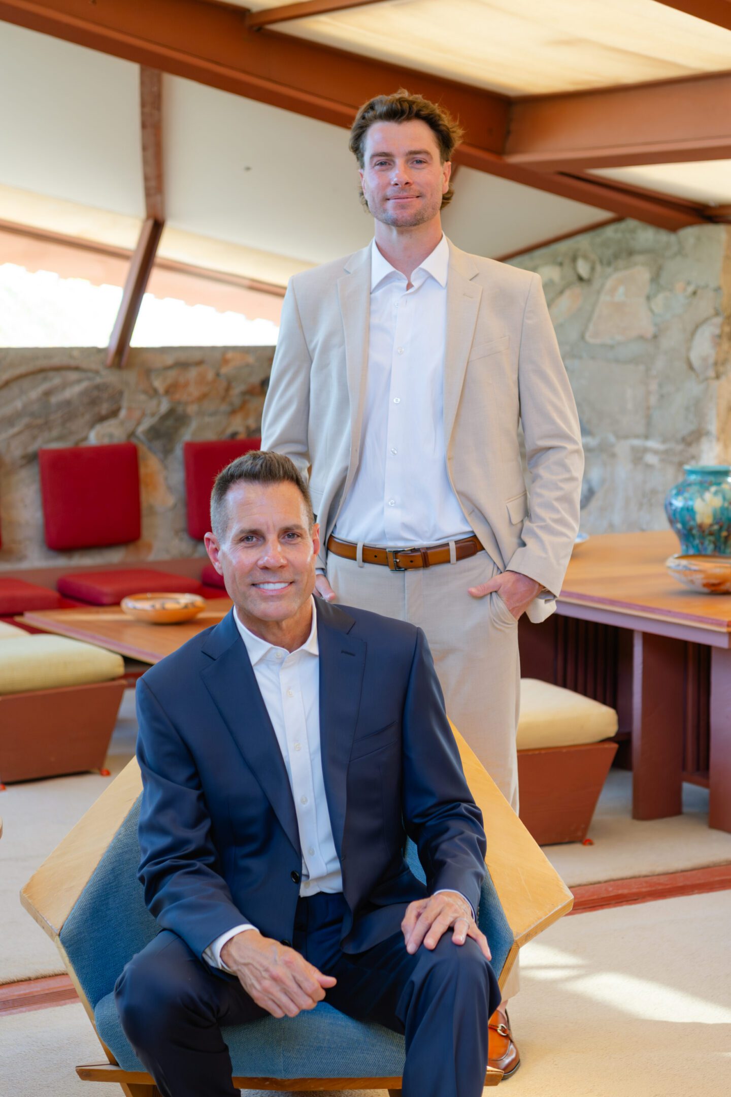 Two men in suits in modern living room