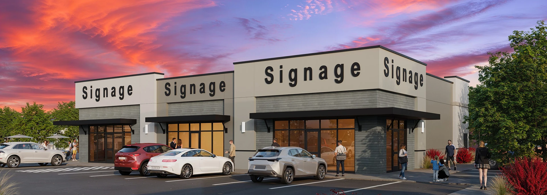 Retail storefronts with parking lot at sunset